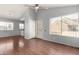 Bright living room with vaulted ceiling, ceiling fan, vinyl floors, and a view to the kitchen at 2035 S Elm St # 218, Tempe, AZ 85282