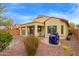 Backyard view featuring a covered patio, desert landscaping, and a private outdoor space at 20512 N 260Th Ln, Buckeye, AZ 85396