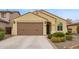 Charming single-story home with a well-maintained yard and attached two-car garage at 20512 N 260Th Ln, Buckeye, AZ 85396