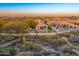 Expansive desert homes featuring backyard pools with mountain views at sunset at 26560 N 115Th St, Scottsdale, AZ 85255