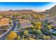 Desert community amid mountain views with homes, pools, and natural landscape at 26560 N 115Th St, Scottsdale, AZ 85255