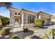 Charming single-story home featuring a desert-style landscape, stucco facade, and a tiled roof in a sunny, inviting setting at 26560 N 115Th St, Scottsdale, AZ 85255