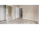 Bright bedroom is decorated with wood floors, neutral paint and closet at 295 N Rural Rd # 151, Chandler, AZ 85226