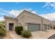 Charming single story home featuring a gray garage door and sidewalk leading to the front entrance at 295 N Rural Rd # 151, Chandler, AZ 85226