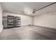 Large garage with storage shelving and an entry door at 295 N Rural Rd # 151, Chandler, AZ 85226