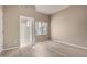 Bright main bedroom featuring wood floors, neutral paint, and an ensuite bathroom at 295 N Rural Rd # 151, Chandler, AZ 85226