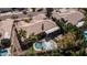 Overhead aerial shot showcases pool, covered patio and well-maintained landscaping of private backyard at 3020 E Rockledge Rd, Phoenix, AZ 85048