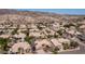 Aerial view showcasing a neighborhood nestled in a desert landscape, surrounded by mountains at 3020 E Rockledge Rd, Phoenix, AZ 85048