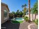 Backyard showcasing a pool, pergola and lush landscaping, perfect for outdoor enjoyment at 3020 E Rockledge Rd, Phoenix, AZ 85048