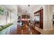 Comfortable breakfast nook in kitchen with a wooden table, built in window seating, and cherry wood cabinets at 3020 E Rockledge Rd, Phoenix, AZ 85048