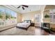 Beautiful main bedroom with large windows, plantation shutters, and a cozy fireplace at 3020 E Rockledge Rd, Phoenix, AZ 85048