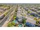 A neighborhood view from above featuring lush green trees and multiple homes with sparkling backyard pools at 3524 E Derringer Way, Gilbert, AZ 85297