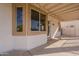 Covered back patio with string lights, neutral paint, and trimmed windows at 3524 E Derringer Way, Gilbert, AZ 85297