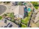 Backyard aerial view featuring the house and a grassy area with a patio at 3524 E Derringer Way, Gilbert, AZ 85297