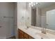 Well-lit bathroom with double sinks, neutral walls, and tiled floor at 3524 E Derringer Way, Gilbert, AZ 85297