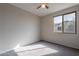 Bedroom featuring a ceiling fan, carpeted floor, and a window at 3524 E Derringer Way, Gilbert, AZ 85297