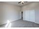 Spacious bedroom with plush carpeting and ample closet space providing comfort and practical storage solutions at 3524 E Derringer Way, Gilbert, AZ 85297