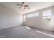 Inviting bedroom with sunlit interiors, featuring plush carpeting, natural light, and a cozy atmosphere at 3524 E Derringer Way, Gilbert, AZ 85297