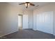 Bedroom featuring a ceiling fan, carpeted floor, and closet at 3524 E Derringer Way, Gilbert, AZ 85297