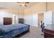 Bedroom featuring vaulted ceiling, natural light, carpet floor, and access to bathroom at 3524 E Derringer Way, Gilbert, AZ 85297