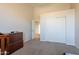 Neutral bedroom featuring a closet with white sliding doors and soft, neutral carpeting at 3524 E Derringer Way, Gilbert, AZ 85297