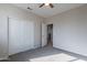 Bedroom featuring a ceiling fan, carpeted floor, and closet at 3524 E Derringer Way, Gilbert, AZ 85297