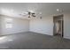 Large bonus room with carpeted floor, ceiling fan, and natural light at 3524 E Derringer Way, Gilbert, AZ 85297