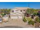 Aerial view showcasing a two-story home with a three-car garage and lush landscaping at 3524 E Derringer Way, Gilbert, AZ 85297