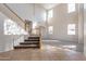 Entryway featuring tile flooring, carpeted stairs, and many windows at 3524 E Derringer Way, Gilbert, AZ 85297