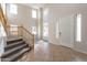 Two-story foyer with tile flooring, carpeted stairs, and lots of natural light at 3524 E Derringer Way, Gilbert, AZ 85297