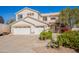 Charming two-story home featuring a three-car garage and well-maintained landscaping in a sunny setting at 3524 E Derringer Way, Gilbert, AZ 85297