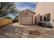 Detached garage includes basketball hoop and has large paved driveway for parking multiple vehicles at 3524 E Derringer Way, Gilbert, AZ 85297