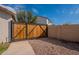 Wooden gate situated between the residence and the backyard of the property at 3524 E Derringer Way, Gilbert, AZ 85297