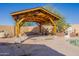 Backyard gazebo featuring stone pillars, a basketball hoop, and pool views at 3524 E Derringer Way, Gilbert, AZ 85297