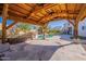 Backyard gazebo featuring stone pillars, a pool, and a home view at 3524 E Derringer Way, Gilbert, AZ 85297