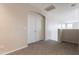 Upstairs hallway featuring double doors, neutral walls, and carpeting at 3524 E Derringer Way, Gilbert, AZ 85297