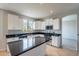 Well-lit kitchen featuring stainless appliances, white cabinets, and a center island at 3524 E Derringer Way, Gilbert, AZ 85297
