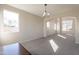 Carpeted living room with archway design, windows and natural lighting at 3524 E Derringer Way, Gilbert, AZ 85297