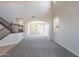 Open living space with high ceilings, a staircase, and arched doorway at 3524 E Derringer Way, Gilbert, AZ 85297