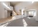 Open concept living area with archways, neutral walls, carpeting, and wooden staircase at 3524 E Derringer Way, Gilbert, AZ 85297