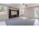 Large living room with built-in media center and neutral color palette at 3524 E Derringer Way, Gilbert, AZ 85297