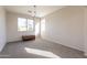 Neutral living room featuring carpeting, large windows, and overhead lighting at 3524 E Derringer Way, Gilbert, AZ 85297