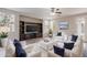 Spacious living room with built-in shelving and plush seating arrangement at 3524 E Derringer Way, Gilbert, AZ 85297