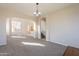 Open-concept living room boasting carpeted floors and natural light at 3524 E Derringer Way, Gilbert, AZ 85297