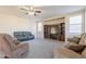 Large living room boasts neutral colors, large windows, a ceiling fan, and a carpeted floor at 3524 E Derringer Way, Gilbert, AZ 85297