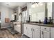 Bright bathroom with double sinks, a soaking tub, and white cabinets at 3562 E Harvard Ct, Gilbert, AZ 85234