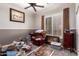 Cluttered bedroom featuring a ceiling fan, shuttered windows, and assorted personal belongings at 3562 E Harvard Ct, Gilbert, AZ 85234