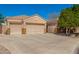 Single-Gathering home featuring three-car garage, wide driveway, desert landscaping, and secured RV parking at 3562 E Harvard Ct, Gilbert, AZ 85234