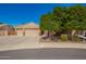 Charming single-Gathering home featuring a three-car garage, desert landscaping, and mature shade tree at 3562 E Harvard Ct, Gilbert, AZ 85234