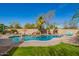 Aerial view of backyard pool featuring rock waterfall and lush greenery, perfect for relaxation at 3562 E Harvard Ct, Gilbert, AZ 85234